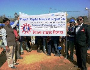 Mr. Rajnish Bhardwaj (standing in Black suit), AVP- Projects, Emaar MGF flagging off the march for World AIDS Day at Project site
